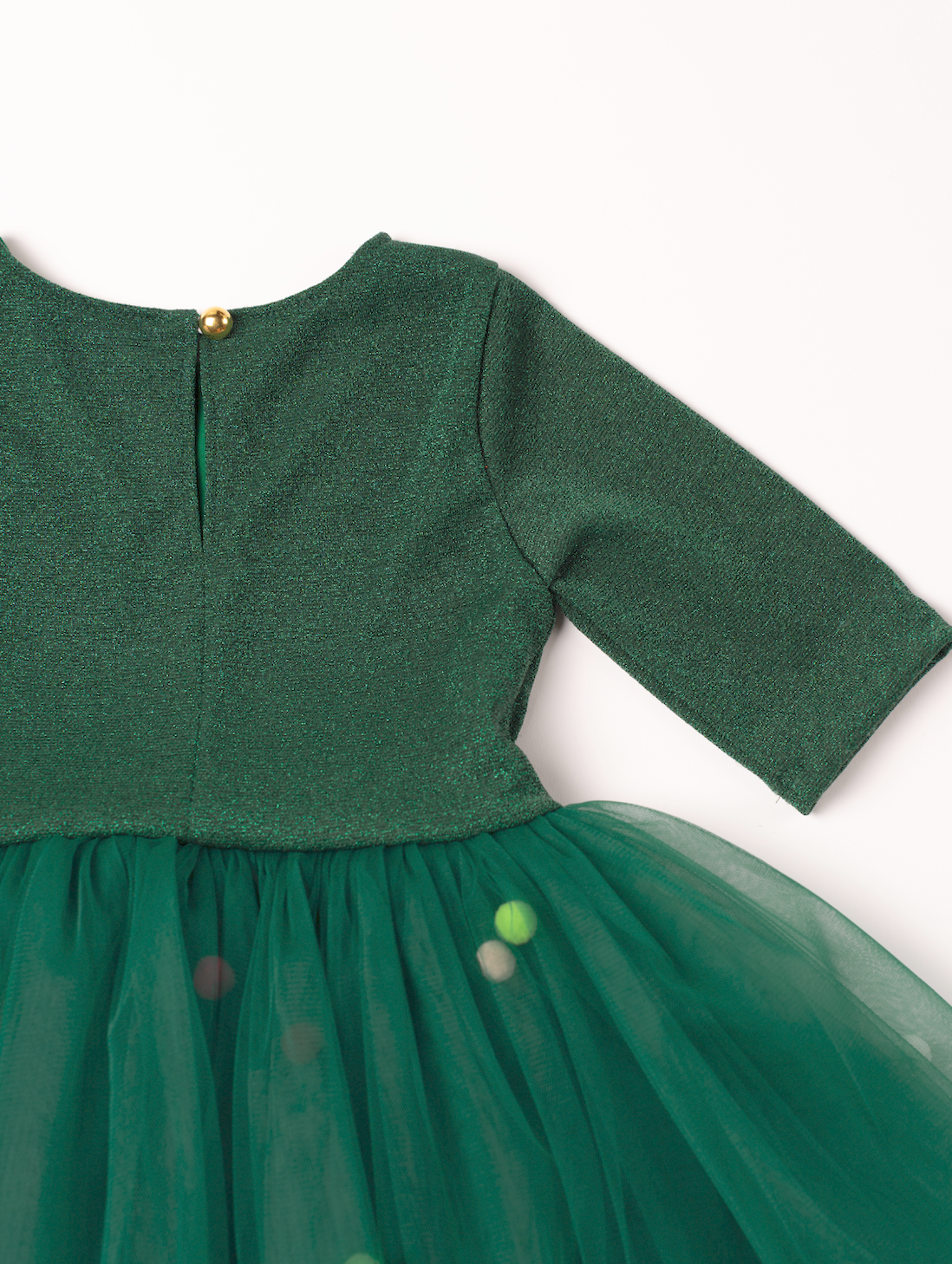 Zaļa spīdīgas trikotāžas kleita ar kuplu svārku daļu